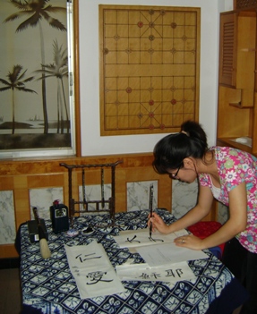 Christy writing Chinese calligraphy