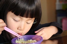 Chinese girl eating noodles